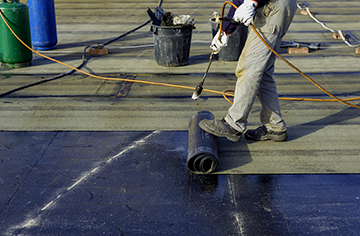 Roofer Installs Membrane Roof