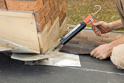 Roofer Repairs Flashing