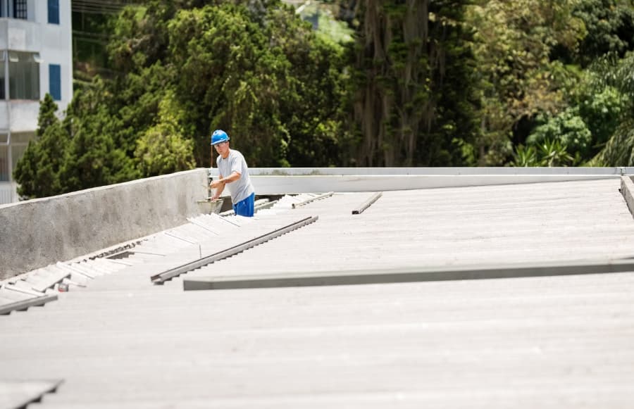 Worker repairing commercial roof