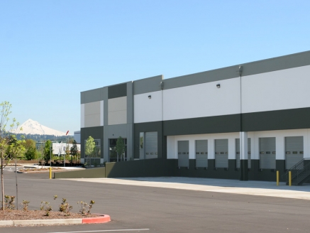 A large industrial building with a flat roof