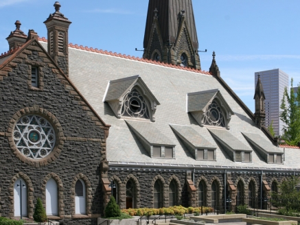 A church with a large, steep slate roof