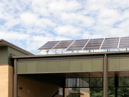 Solar panels atop a commercial building roof